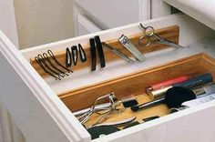 an organized drawer with tools in it