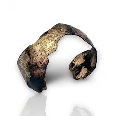 Metal Bracelet - This gracefully flowing steel cuff is fused with multiple powdered metals, including 18k gold, gold/bronze, copper, and champagne brass; the metals flow together on the surface, creating a multi-color veil while the black patina accentuates the various colors of the fused metals. Metallic Bracelet, Color Veil, Keum Boo, Metal Bracelet, Sticks And Stones, Artful Home, Bracelet Cuff, Metal Bracelets, Copper Jewelry