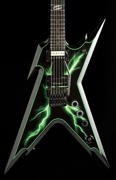 an electric guitar with green lightning on it