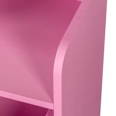 a pink shelf that has some kind of paper on it