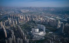 an aerial view of a city with tall buildings