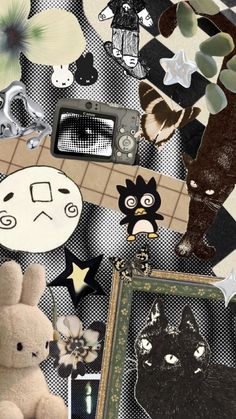 an assortment of stuffed animals and pictures on a tiled floor in a room with black and white wallpaper