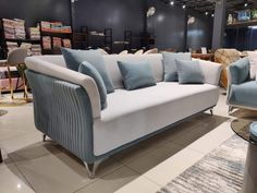 a couch and chair are on display in a store