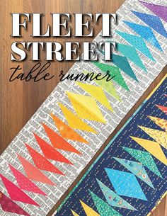 a table runner made out of newspaper strips with the words, felt street table runner