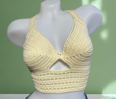 Turn heads and radiate confidence in this exclusive crochet crop top. Handcrafted for a look as unique as you are! This crop is crafted from a luxurious 50% cotton and 50% acrylic blend, offering both the natural breathability of cotton & the soft, comfortable feel of acrylic. Perfect for soaking up the sun in comfort!  ---------CARE-------- For the gentlest care, hand wash it with cool water only and lay it flat to dry. Alternatively, you can machine wash on a gentle cycle with cool water, but Handmade Summer Crochet Halter Neck Top, Handmade Halter Neck Crochet Top For Summer, Bohemian Crochet Halter Neck Crop Top, Bohemian Crochet Crop Top With Halter Neck, Handmade Fitted Halter Top For Vacation, Handmade Fitted Crochet Triangle Top, Handmade Fitted Triangle Crochet Top, Summer Crochet Halter Crop Top, Crochet Lace Crop Top For Beach