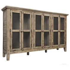 a large wooden cabinet with glass doors on the front and bottom shelves in grey wood