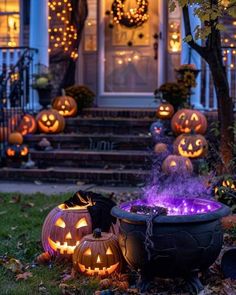 halloween pumpkins lit up in front of a house