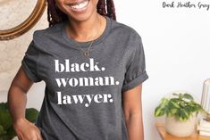 Black Woman Lawyer Tee | Black Owned Shop | Shirt For Black Attorney | Black Law School Student | Black Law School Graduate Gift 🤎  ATXCraft is a Black owned shop!  Checkout our other Black Professional items: https://www.etsy.com/shop/ATXCraft?section_id=37067539 ✔ SHIRT DETAILS: The Bella+Canvas 3001 classic unisex jersey short sleeve tee fits like a well-loved favorite. It feels soft and light with just the right amount of stretch. The 3001 is comfortable and flattering for all. ✔ FABRIC: * Solid colors are 100% combed and ring-spun cotton * Heather colors are 52% combed and ring-spun cotton, 48% polyester * Fabric weight: 4.2 oz/yd² (142 g/m²) * Pre-shrunk fabric * Tear-away label * Shoulder-to-shoulder taping * Runs true to size ✔ CARE INSTRUCTIONS: Machine wash (inside out): warm (m Black Shirt With Text Print Relaxed Fit, Black Long Sleeve Shirt With Text Print, Black Crew Neck Shirt With Text Print, Black Woman Lawyer, Black Attorney, Woman Lawyer, Law School Student, Women Lawyer, Shirt Hair