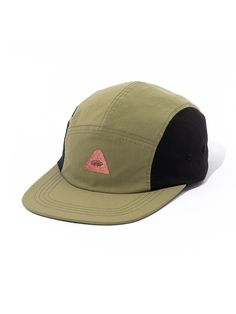 a green and black hat with an orange triangle on the front, sitting against a white background