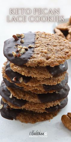 a stack of cookies with chocolate frosting and nuts