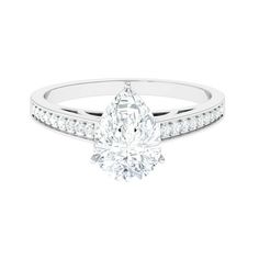 a white gold engagement ring with a pear shaped diamond