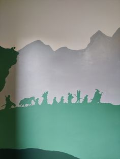 the silhouettes of people and animals are shown in this wallpapered scene with mountains