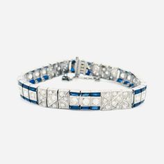 Antique Art Deco Platinum Diamond & Sapphire Bracelet - Vintage Estate 1940s, 7" Length, 31.3g, Box Clasp with Safety Chain Item Description: Discover the timeless elegance of this Antique Art Deco Platinum Bracelet, an exquisite piece from the 1940s vintage estate collection. Crafted with meticulous attention to detail, this stunning bracelet features a dazzling array of diamonds and vibrant sapphires, set in luxurious platinum. The bracelet measures 7 inches in length and weighs a substantial 31.3 grams, ensuring a comfortable yet secure fit with its box clasp and safety chain. Whether you're a collector of antique jewelry or looking for a unique statement piece, this Art Deco bracelet is the perfect addition to your collection. Embrace the glamour and sophistication of the past with thi Luxury Art Deco Jubilee Bracelet, Platinum Bracelet, Art Deco Bracelet, Safety Chain, Box Clasp, Sapphire Bracelet, Bracelet Vintage, Antique Art Deco, Bracelets And Charms