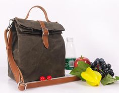 a brown bag sitting next to some fruit