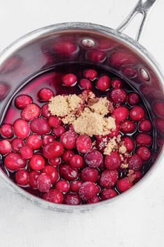 cranberries and sugar in a pot with water