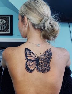 a woman with a butterfly tattoo on her back