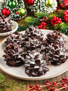 chocolate pineapples on a plate with christmas decorations in the background