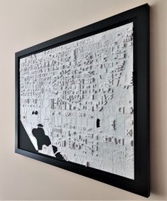 a black and white map hanging on the wall