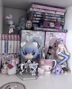 a shelf filled with anime figurines and books