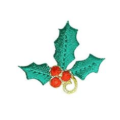 an embroidered holly leaf with red berries on it