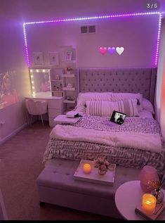 a bed room with a neatly made bed and purple lighting