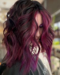 Purple Hair For Fall, Good Colors To Cover Grey Hair, Haircolor Ideas 2023 Fall, Vibrant Peekaboo Hair, Fun Brunette Hair Color Ideas For Fall, Red Violet Highlights On Dark Hair, Red Purple Balayage, Bright Colored Hair Ideas, Cool Fall Hair Color