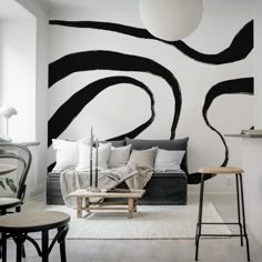 a living room with black and white decor