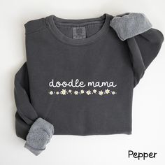 Doodle Mama Sweatshirt, Doodle Mom T-Shirt, Labradoodle Mama Gift, Golden Doodle Sweater, Doodle Dog Lover Gift, Dog Owner Shirt, S055 Each sweatshirt features a relaxed fit, rolled-forward shoulders, and a back neck patch, all in the classic Comfort Colors style. --Sweatshirt Fabric: 80% ring-spun cotton, 20% polyester Weight: Medium-heavy fabric (9.5 oz/yd² or 322.1 g/m²) Fit: Relaxed fit --T-Shirt The sizing is true to size, but please refer to the size chart for exact measurements. If you prefer a t-shirt dress style, consider sizing up by 2 sizes. The design is printed directly onto the fabric, giving it a slightly 'distressed' look. You'll find that the t-shirt material becomes softer after washing! Fabric: 100% ringspun cotton Fit: Loose fit Label: Sewn-in Sizing: True to size --Car Sweater Doodle, Doodle Mom, Golden Doodle, Doodle Dog, Mama T Shirt, Style Sweatshirt, Mama Gifts, Sweatshirt Fabric, Mama Sweatshirt