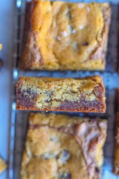 several pieces of cake sitting on top of a cooling rack