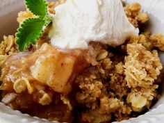 a close up of a plate of food with fruit and ice cream on top,