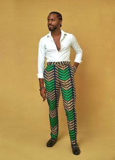 Bright color African print Men's  Pants made from Ankara fabric . PRODUCT DETAILS  -Straight Fit  -Belt Loop -Hidden fasteners -Fixed waistband -Side pocket -Poly-cotton                Model is wearing a small   SEE SIMILAR ITEMS https://www.etsy.com/listing/709485019/ankara-mens-pants-african-mens-pants?ref=shop_home_active_22&frs=1 https://www.etsy.com/listing/789464713/ankara-mens-pants-african-mens-pants?ref=shop_home_active_29&frs=1 https://www.etsy.com/listing/709471743/ankara-mens-pants-a Fitted Traditional Trousers, Traditional Fitted Green Bottoms, Fitted Traditional Green Bottoms, Traditional Fitted Green Pants, Fitted Green Traditional Pants, African Print Pants For Men, Ankara Trousers Pants, African Print Pants High Waist Trousers, Ankara Cargo Pants