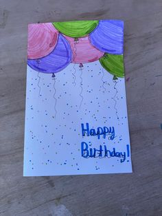 a birthday card with balloons and confetti on it