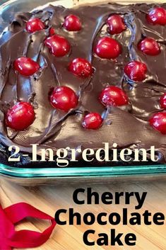 a chocolate cake with cherries on it and the words 2 ingredient cherry chocolate cake