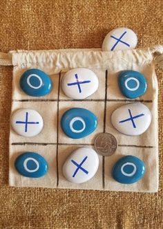 buttons are arranged in the shape of an xo and o on a cloth bag