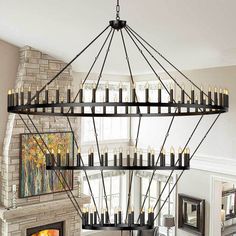 a chandelier with candles hanging from it's sides in a living room