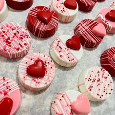 some heart shaped cookies are on a table