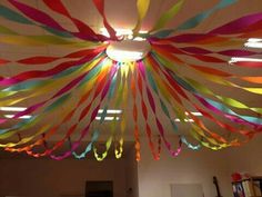 colorful streamers hang from the ceiling in an office