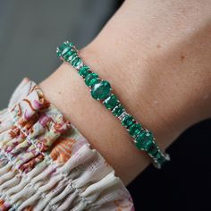 DETAILS Emerald Weight: 13.41 CT Emerald Measurements: 4x3 - 7.5x5.5 mm Diamond Weight: 0.29 CT Metal: 18K White Gold/14.45 gm Birthstone: May Product ID: MUR23846/Line 15 STYLES This bracelet can be made to order in precious gemstones such as ruby and sapphire.  CUSTOM ORDER We customize high jewelry made with quality gemstones and diamonds. Please allow custom order 1-2 weeks.  * Extensive collection of colored gemstones for you to choose from - Emerald, Ruby, Sapphire, Alexandrite (+ some collection of semi precious) * CAD - any 3D design  * Ethically sourced  * Made in USA SHIPPING All items will be shipped in safe and protective packaging within 1 day including tracking.  Please contact for more details about our product or for custom orders!  Jewels On 47th specialize in Emerald💚 Ru Oval Gemstone Tennis Bracelet In Fine Jewelry Style, Oval Prong Set Bracelet In Fine Jewelry Style, Oval Fine Jewelry Bracelet With Prong Setting, Oval Tennis Bracelet For Anniversary, Fine Jewelry, Oval Tennis Bracelet For Anniversary, Anniversary Oval Tennis Bracelet Fine Jewelry, Round White Gold Bracelets With Emeralds, White Gold Emerald Bracelets, White Gold Emerald Bracelet