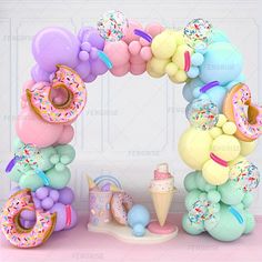 a balloon arch with donuts, ice cream and sprinkles