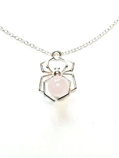 A pink, sterling silver spider pendant necklace with Rose Quartz stone. Comes with its own sterling silver chain.Perfect for gift giving this Valentine's day, Rose Quartz is known as the 'stone of love'.Pale pink, 6mm Rose Quartz set into the centre of a  sterling silver spider with a delicate silver trace chain.With a shorter chain, this spider necklace hangs roughly on the upper chest area when worn. The last photo of our green Aventurine spider necklace gives an idea of the size/length when w Halloween Jewellery, Gothic 1, Vampire Jewelry, Pink Spider, Spooky Spooky, Aventurine Jewelry, Gothic Jewellery, Spider Necklace, Necklace Gothic