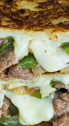 a grilled cheese sandwich with meat and green peppers