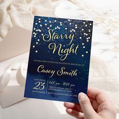 someone holding up a starr night party card