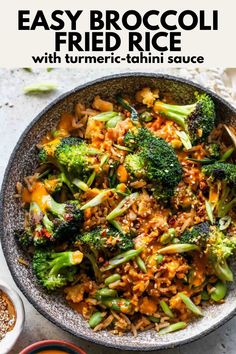 a bowl filled with rice, broccoli and other vegetables