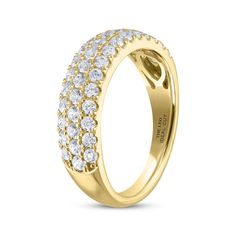 a yellow gold ring with white diamonds