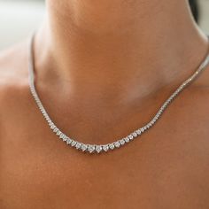 Elevate your fashion game with our Lab-Created Diamond Riviera Necklace, a testament to refined style. This necklace showcases stunning lab-created diamonds in a 3-prong setting, delivering an extraordinary total carat weight of 5.50. With their captivating brilliance, F-G color, and SI clarity, the diamonds radiate elegance. The necklace's meticulous craftsmanship in 14K white gold adds a touch of sophistication, making it an ideal accessory for any occasion. Riviera Necklace, Diamond Necklace Wedding, Diamond Tennis Necklace, Tennis Necklace, Green Diamond, Diamond Design, Brilliant Diamond, Lab Created Diamonds, Perfect Gift For Her