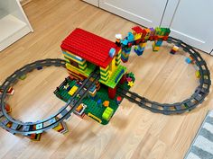 a toy train set is on the floor