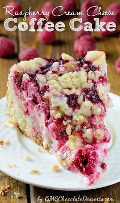 a slice of raspberry cream cheese cake on a white plate with a fork