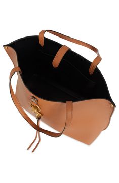 Polished clip-lock hardware adds a signature touch to a roomy leather tote in a slightly structured silhouette. Magnetic-snap tab closure Exterior slip pocket Interior wall pocket Leather Imported A Signature, Interior Wall, Wall Pockets, Rebecca Minkoff, Leather Tote, Nordstrom, Exterior, Wall, Leather