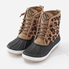 Looking for statement footwear? We’ve put a modern animal print spin on your favorite classic Marleylilly duck boot styles. Our Monogrammed Leopard Duck Boots are a must-have footwear addition to the leopard-loving gal’s wardrobe. Available in multiple colors, these faux leather, faux calf hair and rubber boots will fit the bill with any gal. Featuring the warm and waterproof lace-up duck boot design, these comfortable and cute boots are ideal for year-round comfort. Add them to your Duck Boot Socks, Monogram Vest, Monogrammed Rain Jacket, Boots With Fur, Womens Duck Boots, Faux Hair, Boot Design, Leopard Boots, Duck Boot