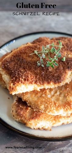 some fried food on a white plate with green garnish and the words gluten free schnitzel recipe